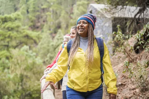 a woman hiking with a group