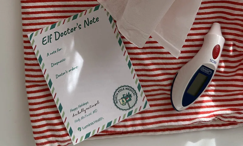 Elf Wellness during the holiday season - photo of a doctors note for your elf, thermometer, and tissues