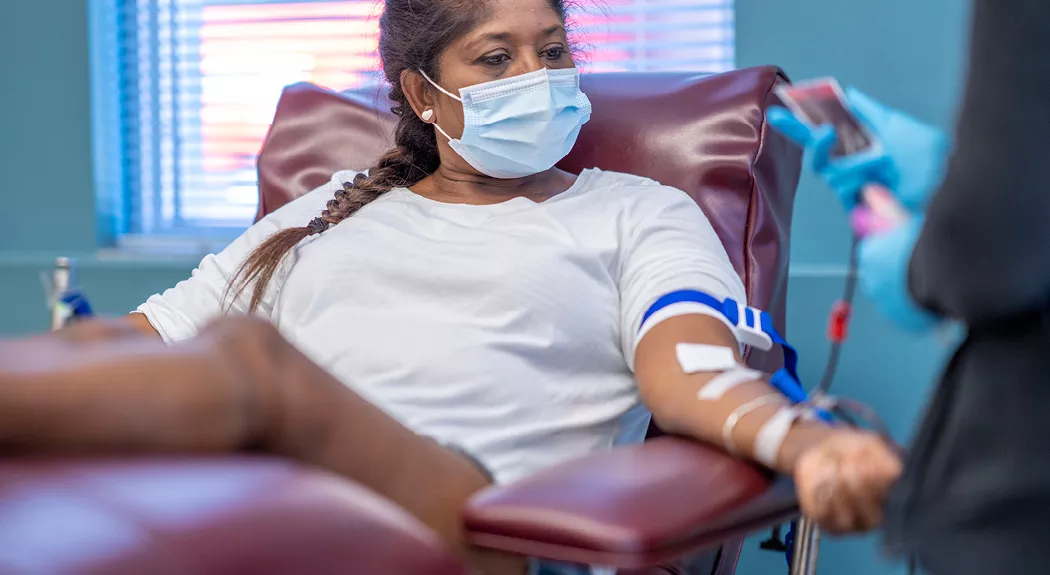 latina woman giving blood