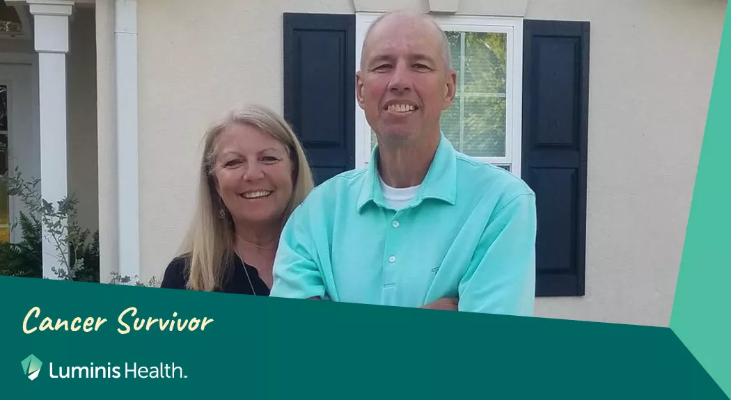 Larry and his wife standing together with a graphic that says Cancer Survivor