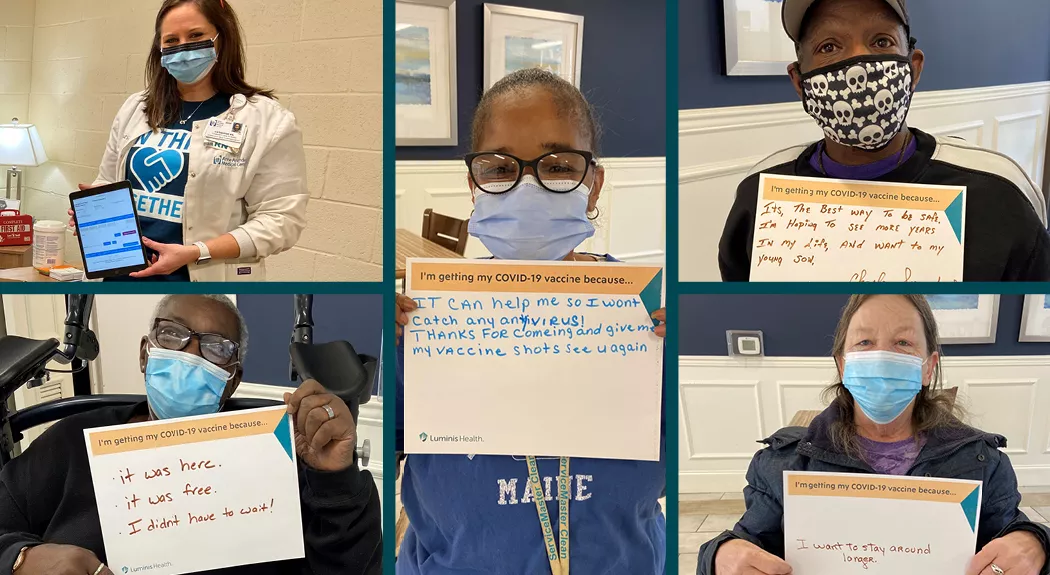 Several residents of Bowman Place holding a covid vaccination sign