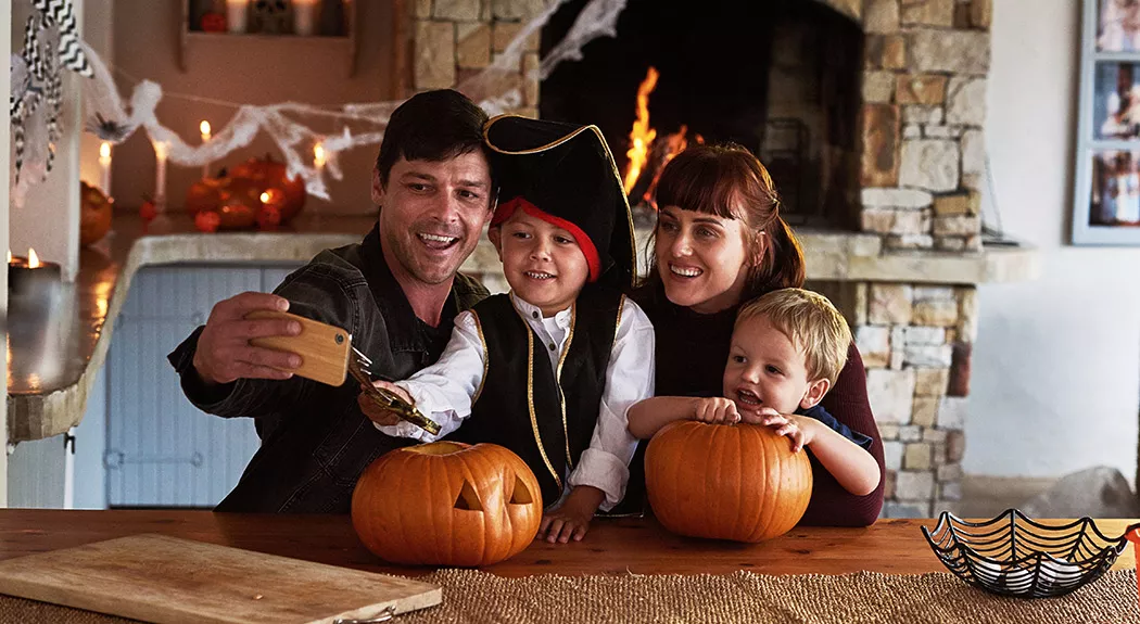 family celebrating Halloween at home