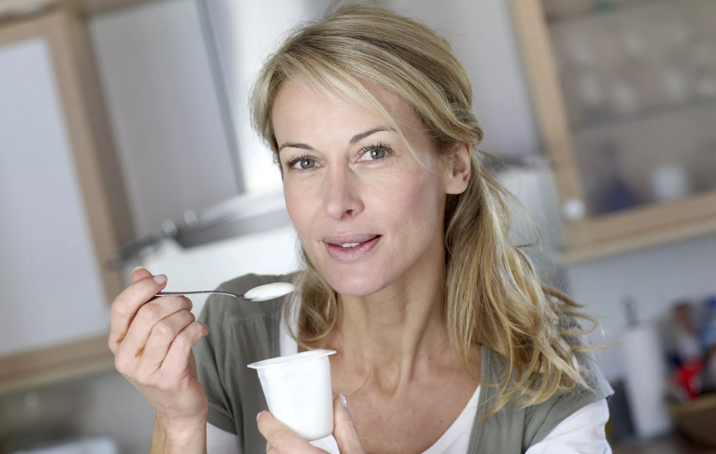 woman eating yogurt