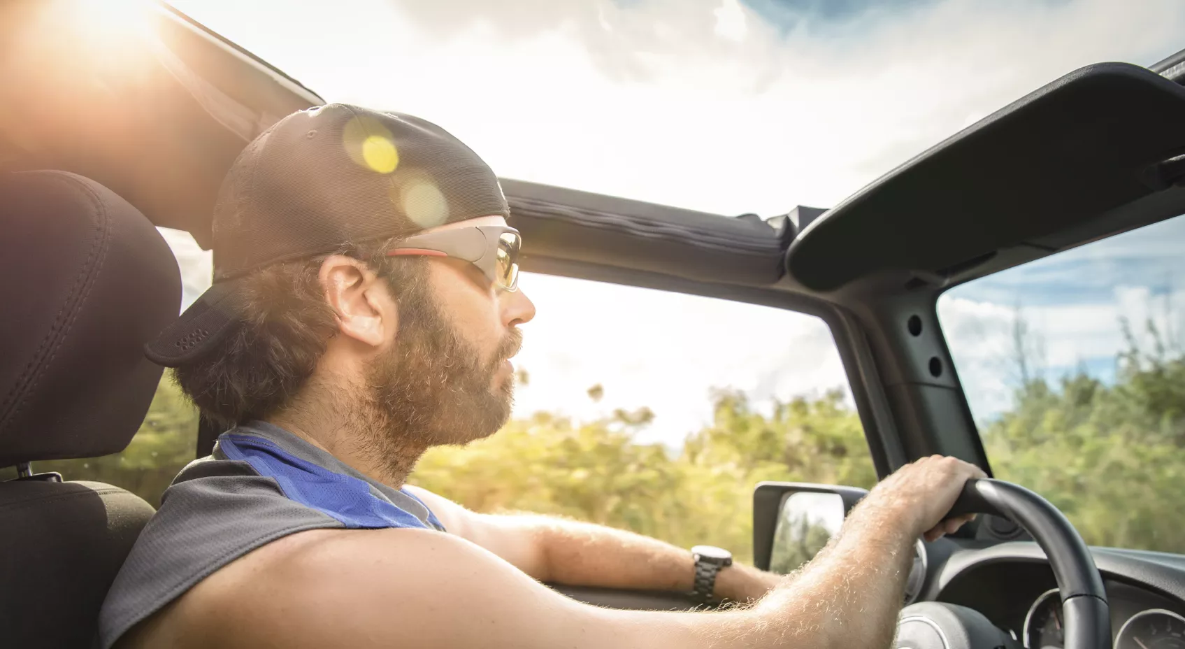 man driving car