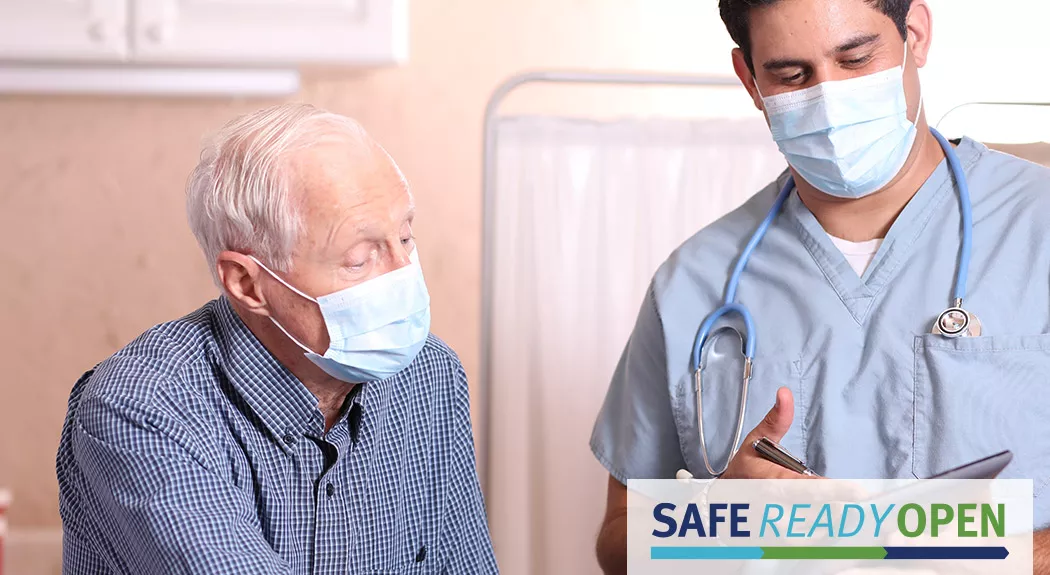 older male patient speaking to doctor