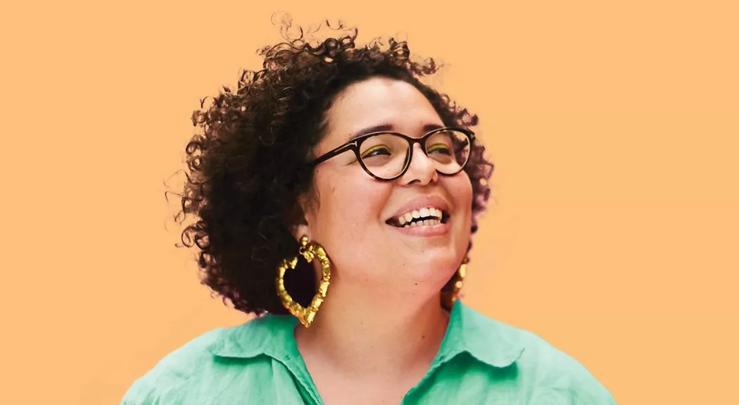 Woman wearing heart earrings smiling