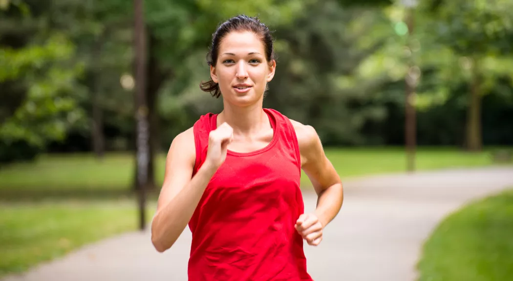 Young woman jogging in park